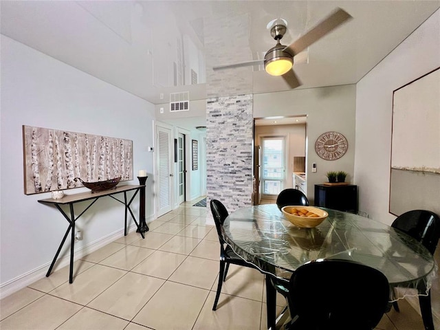 dining area featuring ceiling fan and light tile patterned floors