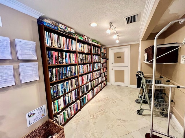 office area with rail lighting, crown molding, and a textured ceiling