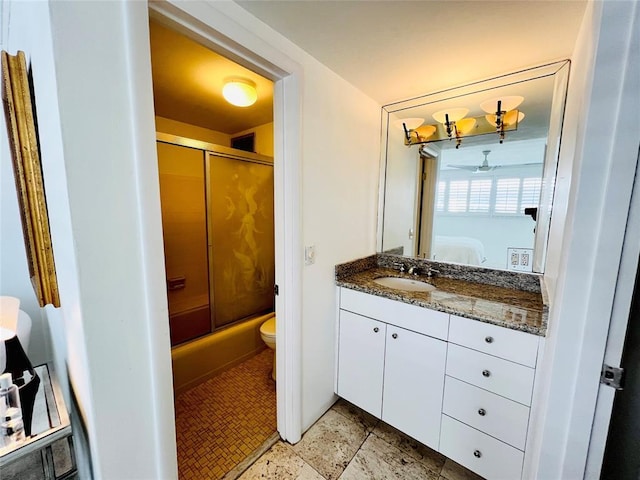 bathroom with vanity, ceiling fan, and toilet