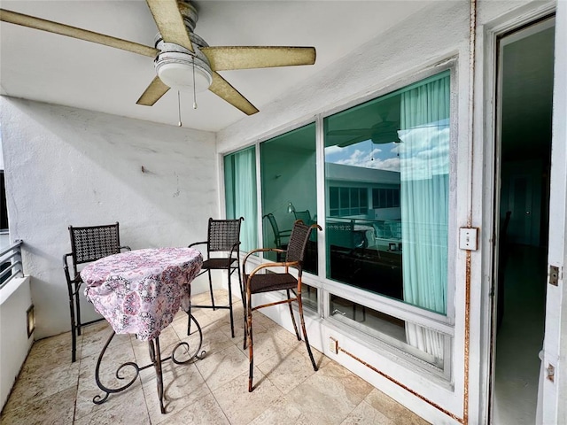 interior space featuring ceiling fan