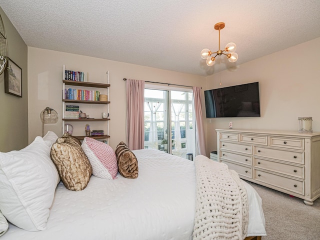 bedroom featuring light colored carpet, a chandelier, and a textured ceiling