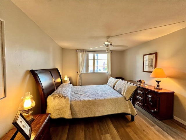 bedroom featuring ceiling fan and light hardwood / wood-style floors