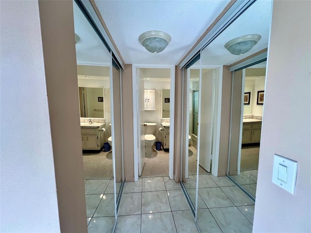 hallway featuring light tile patterned floors