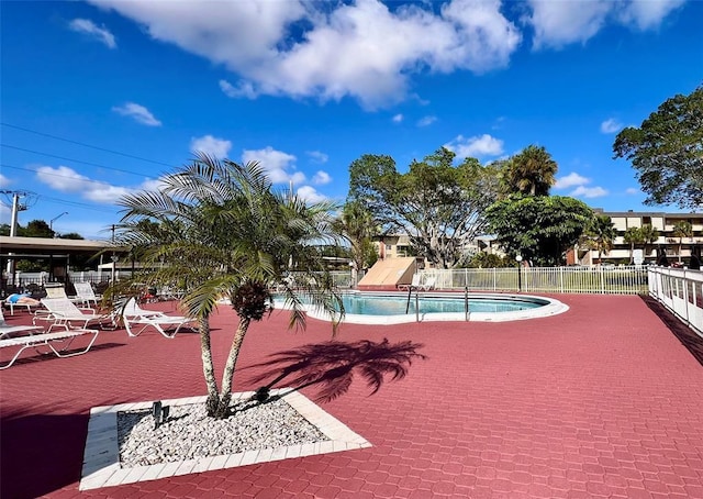 view of swimming pool with a patio area