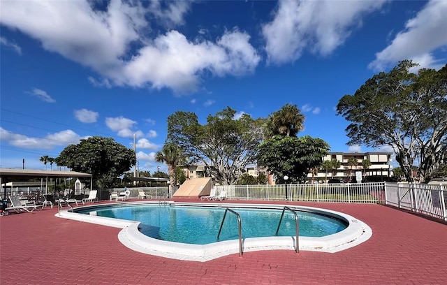 view of swimming pool featuring a patio