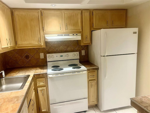 kitchen with sink, tasteful backsplash, tile countertops, white appliances, and light tile patterned flooring