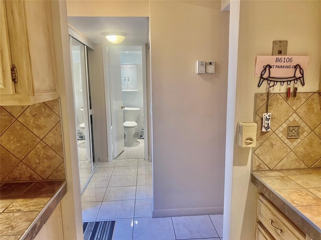 hallway featuring light tile patterned flooring