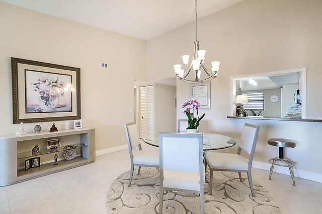 living room with light tile patterned floors and an inviting chandelier