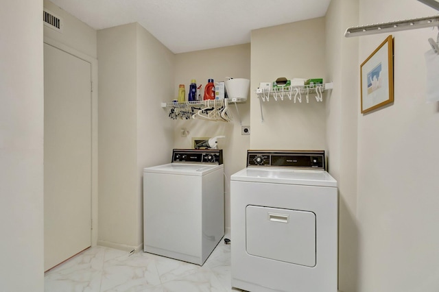 laundry room featuring independent washer and dryer