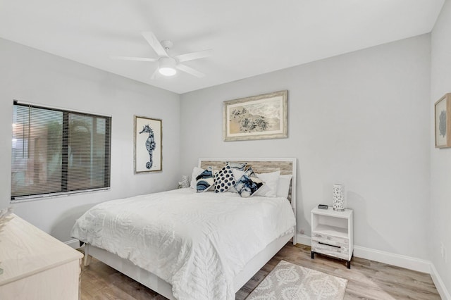 bedroom featuring ceiling fan and hardwood / wood-style floors