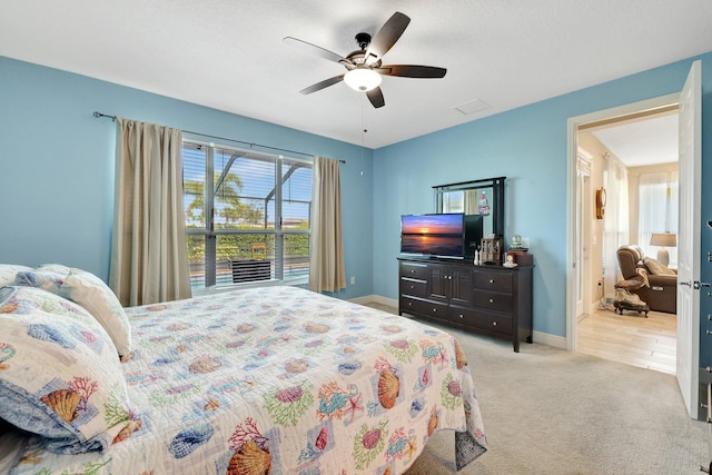 bedroom with light carpet and ceiling fan