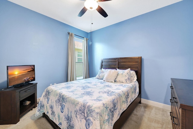 bedroom with ceiling fan and light colored carpet