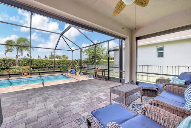 view of pool featuring an outdoor hangout area, a patio area, ceiling fan, and a lanai