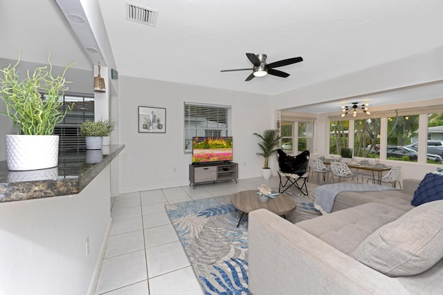 living room with ceiling fan and light tile patterned floors