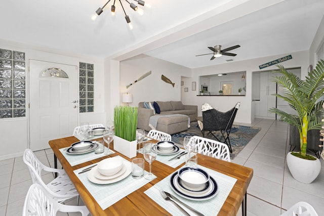 tiled dining room featuring ceiling fan