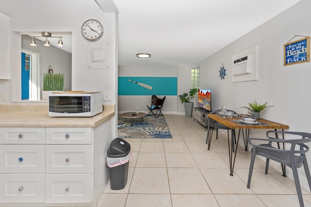 bathroom with tile patterned floors and a wall mounted AC