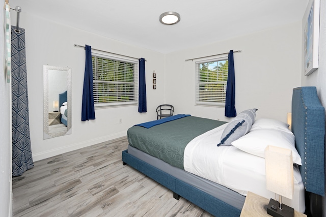 bedroom with light wood-type flooring