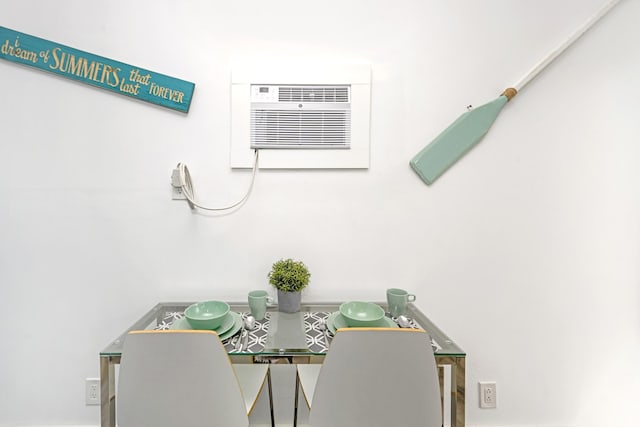 dining area featuring a wall unit AC