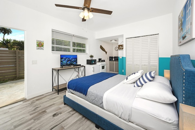 bedroom with light hardwood / wood-style flooring, a closet, and ceiling fan