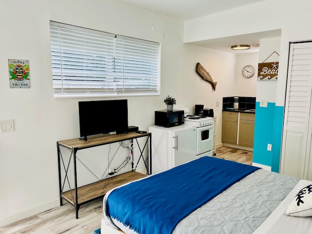 bedroom with light wood-type flooring