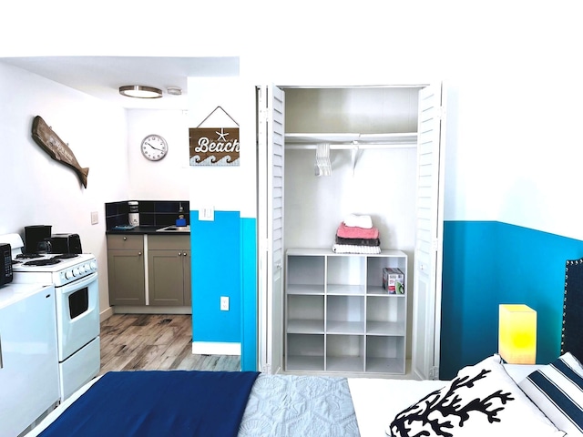 bedroom featuring a closet and light hardwood / wood-style flooring