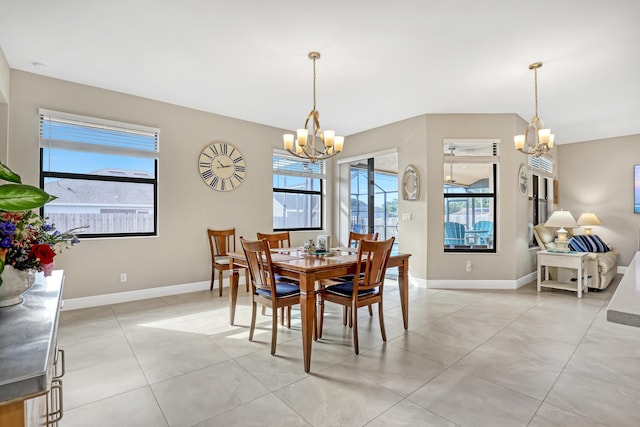 dining area featuring an inviting chandelier and light tile patterned floors