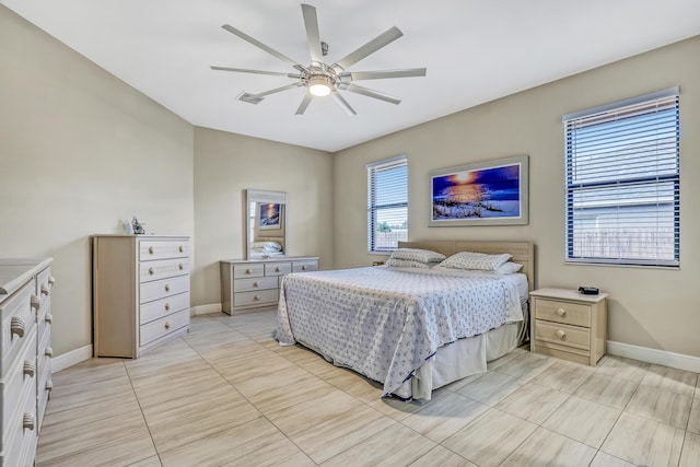 tiled bedroom with ceiling fan