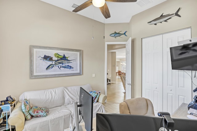 living room with ceiling fan and lofted ceiling