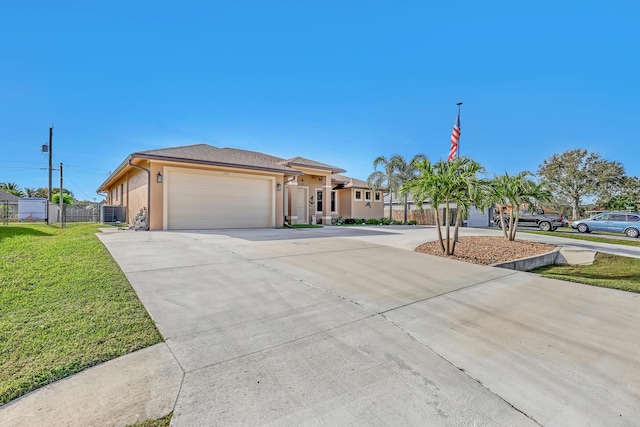 view of front of property featuring a garage and a front yard