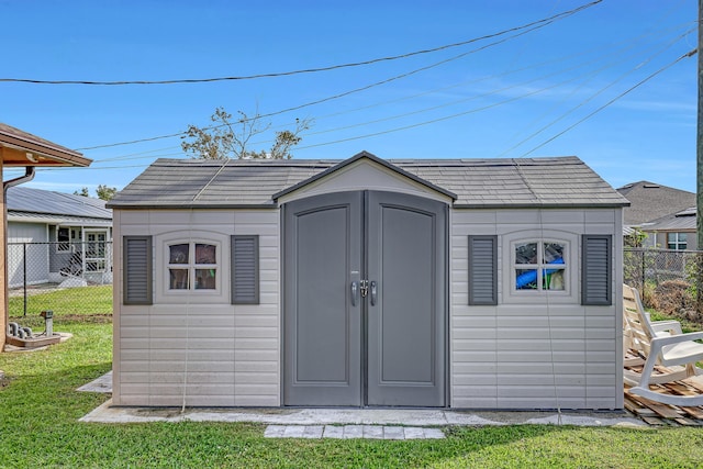 view of outbuilding featuring a yard