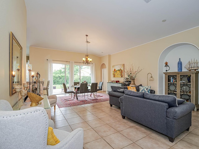 living room with light tile patterned floors and an inviting chandelier