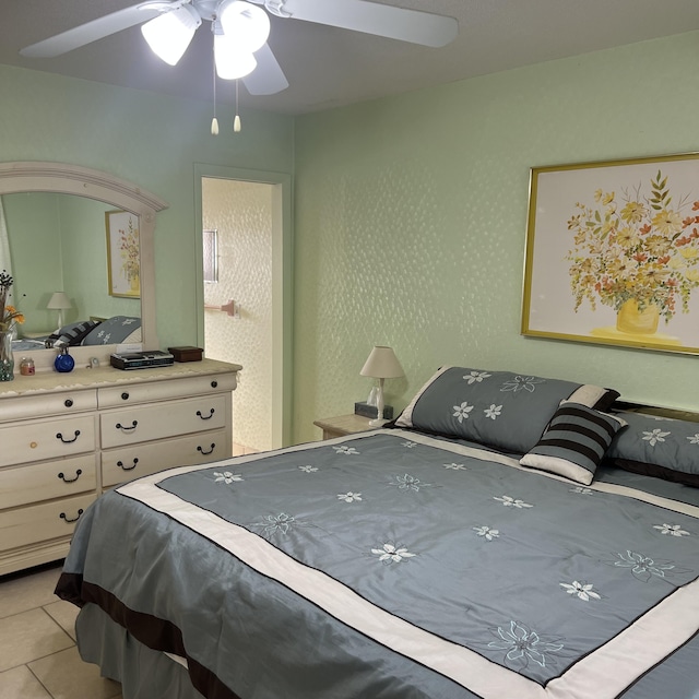 bedroom featuring a ceiling fan and light tile patterned floors