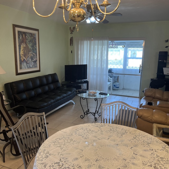 living area with a chandelier and tile patterned floors