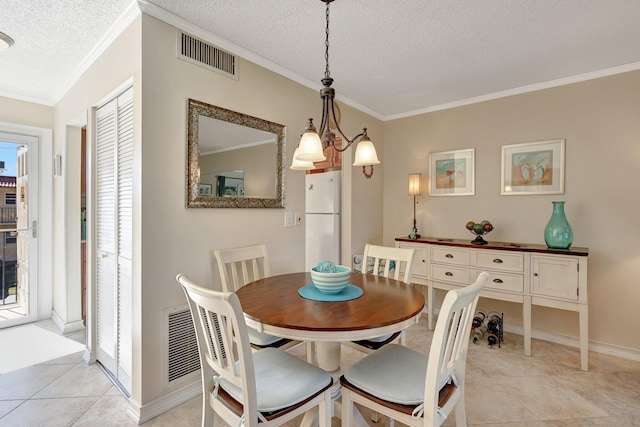 dining room featuring crown molding, light tile patterned floors, a textured ceiling, and a notable chandelier