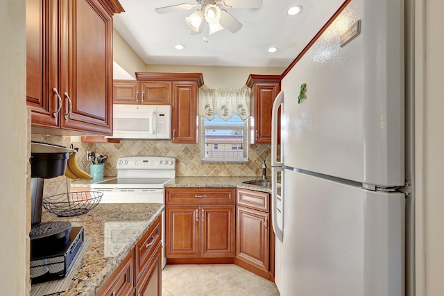 kitchen featuring white appliances, sink, ceiling fan, light tile patterned floors, and tasteful backsplash