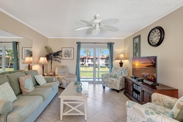 living room featuring ceiling fan, crown molding, a textured ceiling, and a wealth of natural light