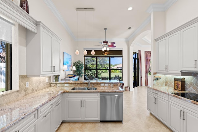 kitchen with white cabinets, sink, backsplash, hanging light fixtures, and stainless steel dishwasher