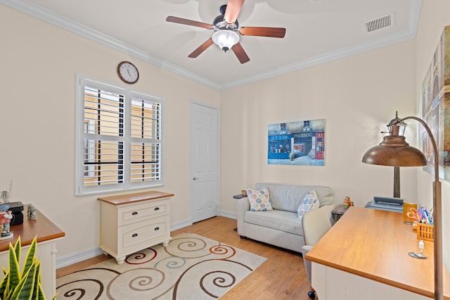 office area with ceiling fan, ornamental molding, and light hardwood / wood-style floors