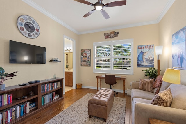 living room featuring ceiling fan, ornamental molding, and hardwood / wood-style floors