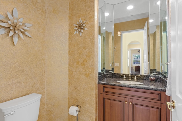 bathroom with toilet and vanity