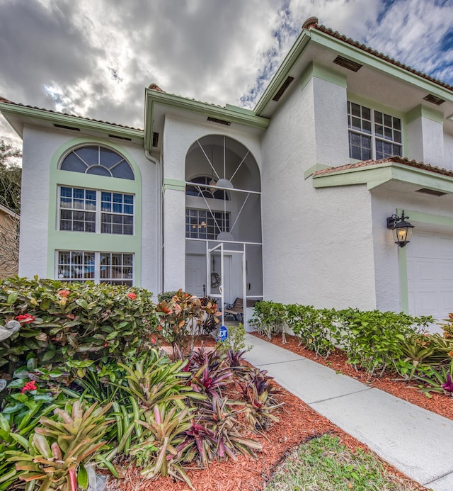 view of exterior entry with a garage