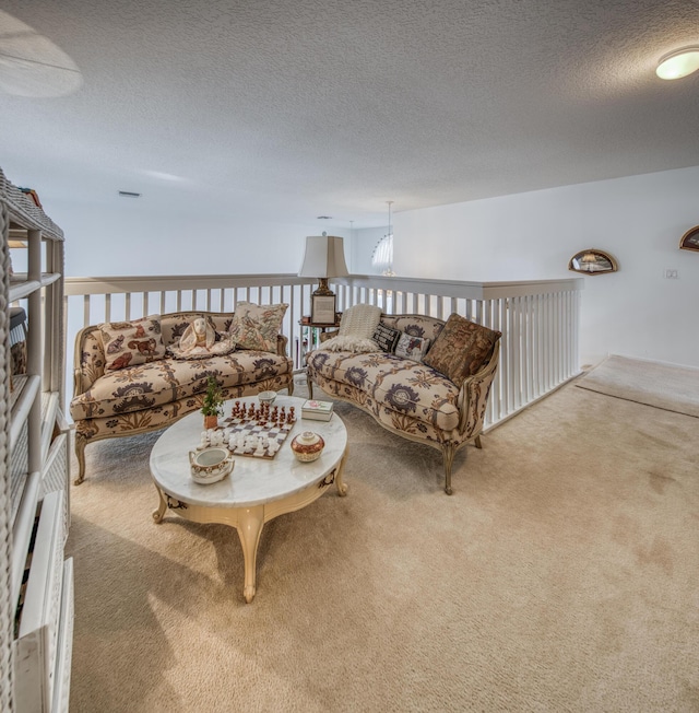 carpeted living room with a textured ceiling