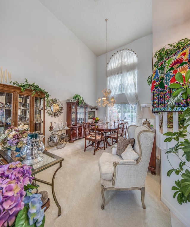 dining area with light carpet, a chandelier, and vaulted ceiling