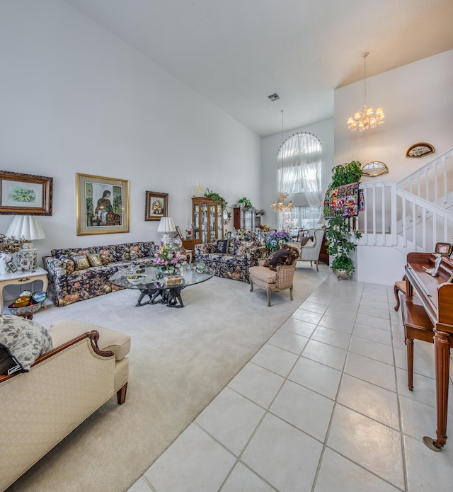 tiled living room featuring a high ceiling and a chandelier