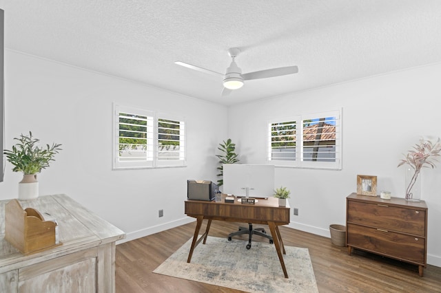 office area with ceiling fan, wood-type flooring, and a textured ceiling