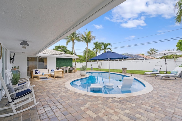 view of pool featuring an outdoor hangout area and a patio