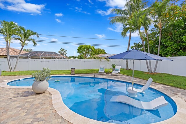 view of pool with an outdoor living space and a patio