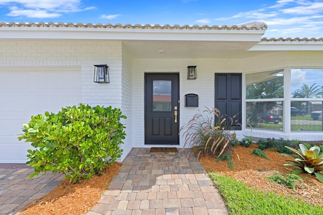 entrance to property featuring a garage