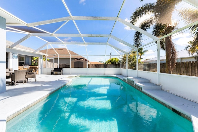 view of pool featuring a lanai and a patio area