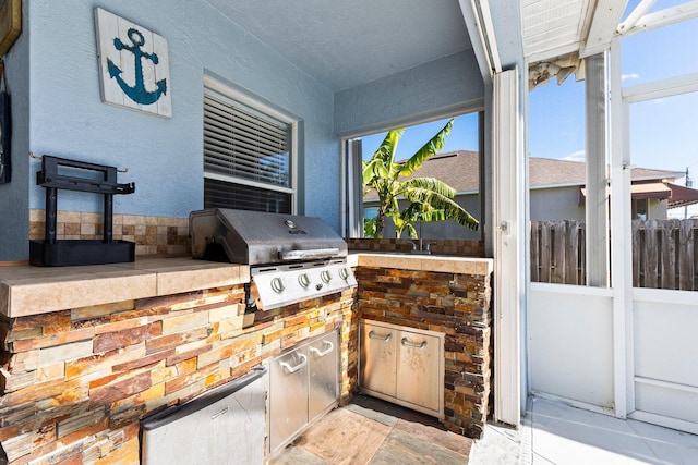 view of patio featuring area for grilling and an outdoor kitchen